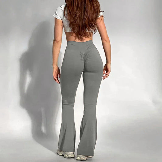 Wearing gray flared pants and a white top